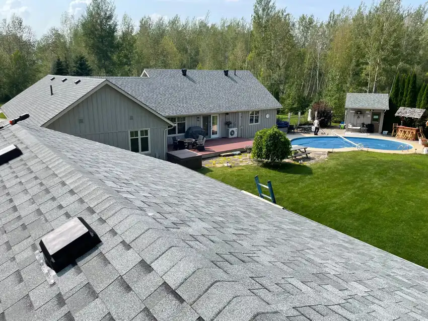 Roofing crew completing a residential roof in the Midland area